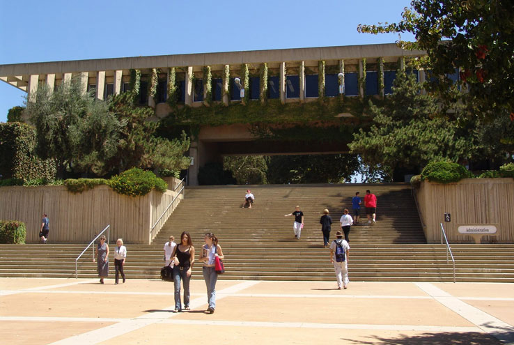 Students walking up and down a large set of stairs.